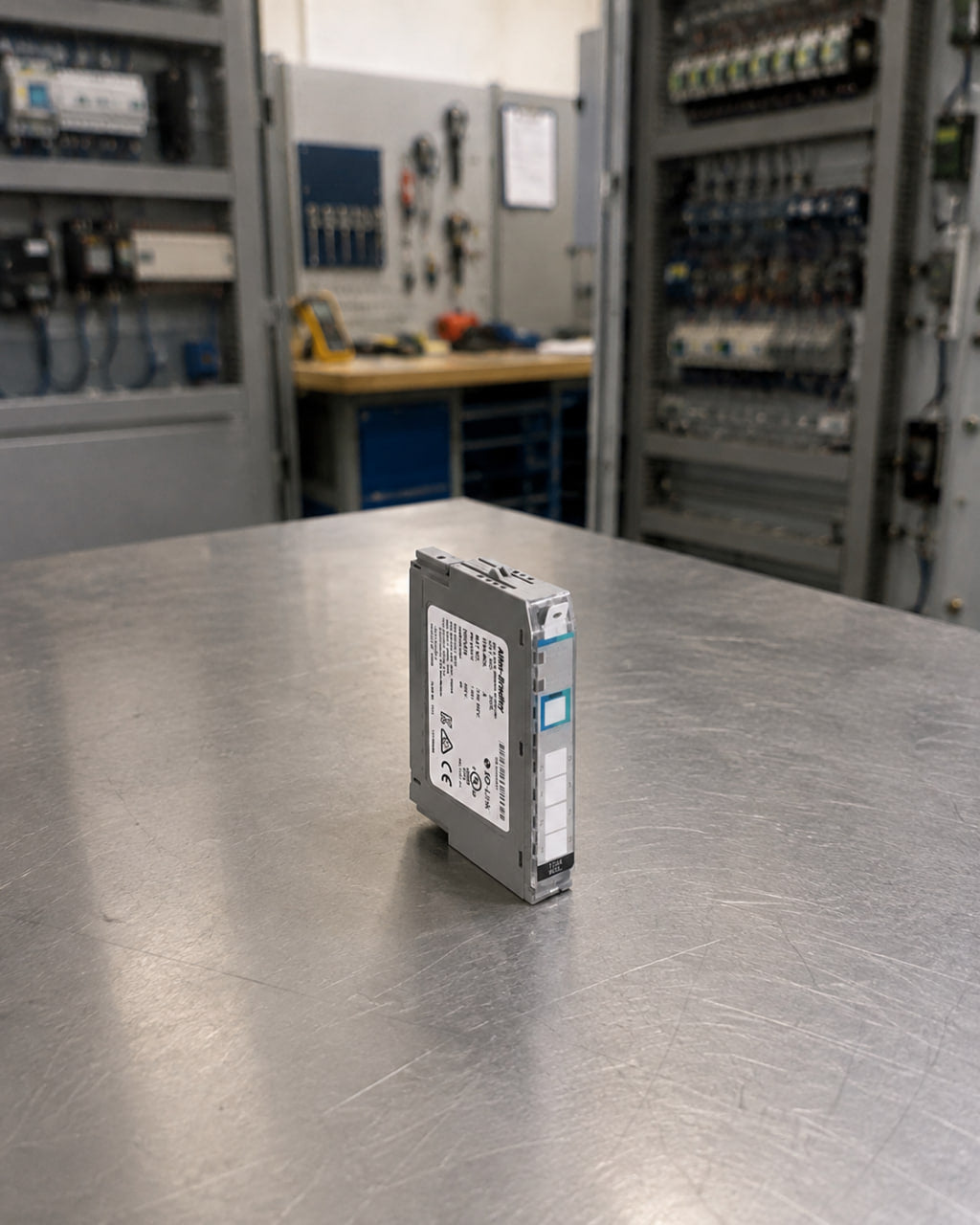Allen-Bradley 1734-4IOL POINT I/O IO-Link master module standing on a workbench in a panel shop