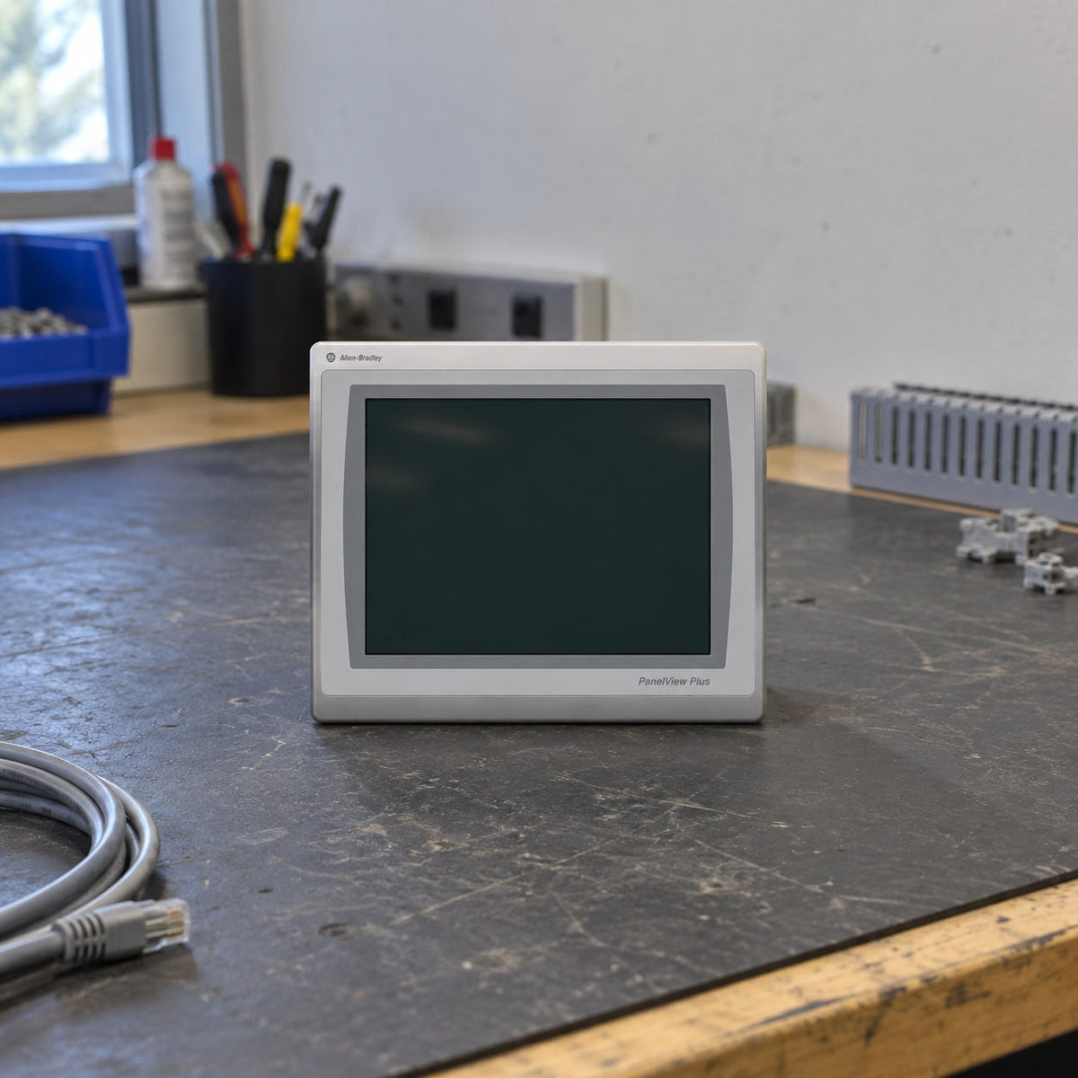 Allen-Bradley PanelView Plus 7 terminal on a panel shop bench with the screen off