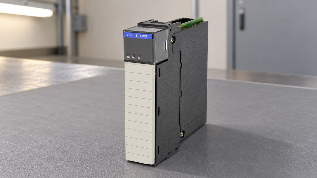 Allen-Bradley 1756-ENET ControlLogix Ethernet module standing upright on a gray mat on a workbench